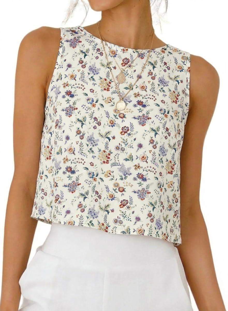 Floral print sleeveless crop top with round neckline, paired with white pants for a chic summer look