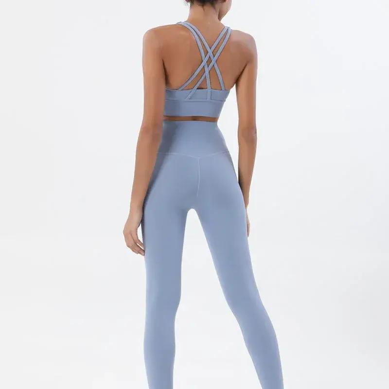 Women's high-waist seamless yoga set by Style Point BD, breathable sports bra and leggings for comfortable gym wear.