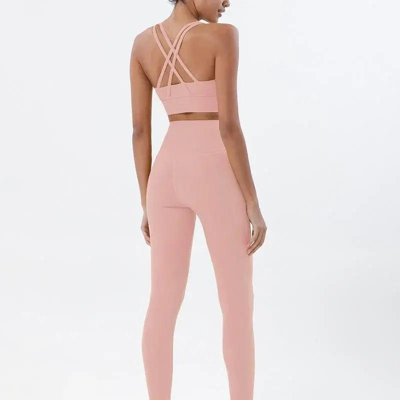 Women's high-waist seamless yoga set with breathable sports bra and leggings by Style Point BD for comfortable gym wear.
