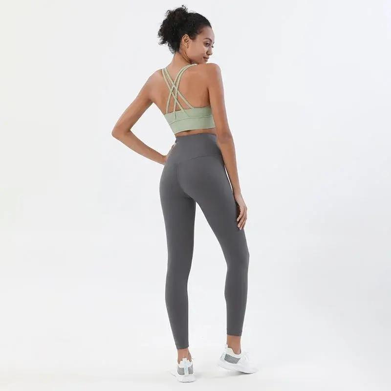 Women's high-waist seamless yoga set with breathable sports bra and leggings from Style Point BD, perfect for active gym wear.