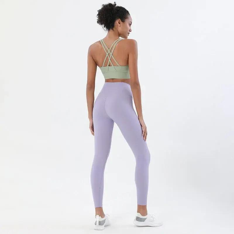 Women's high-waist seamless yoga set with breathable sports bra and leggings from Style Point BD, designed for comfortable gym wear.