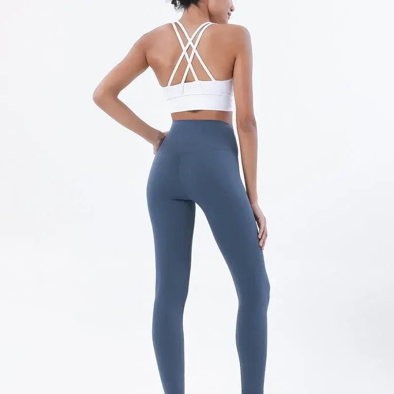 Women's high-waist seamless yoga set with breathable sports bra and leggings in black, from Style Point BD for active wear.